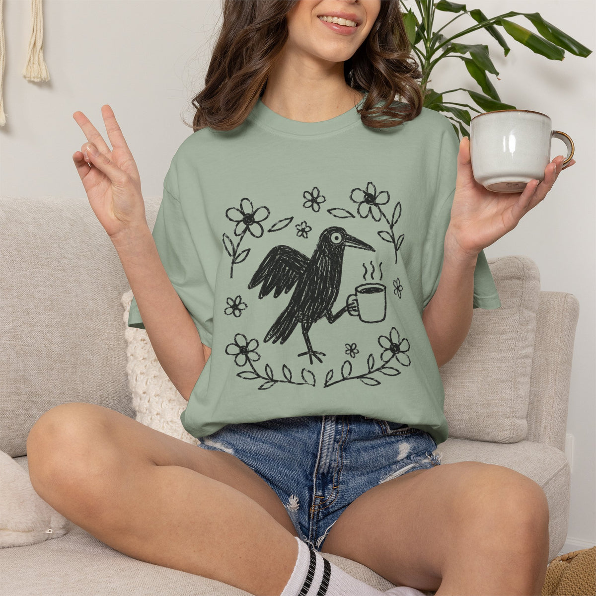Cute Crow Holding Coffee Comfort Colors T-Shirt | Whimsical Hand-Drawn Bird Graphic Tee